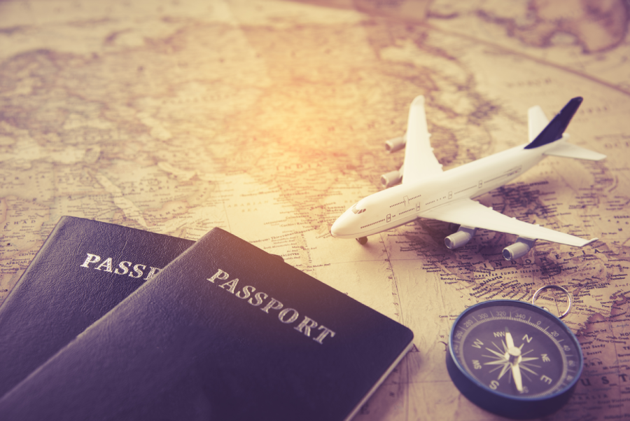 passport plane compass placed map concept travel